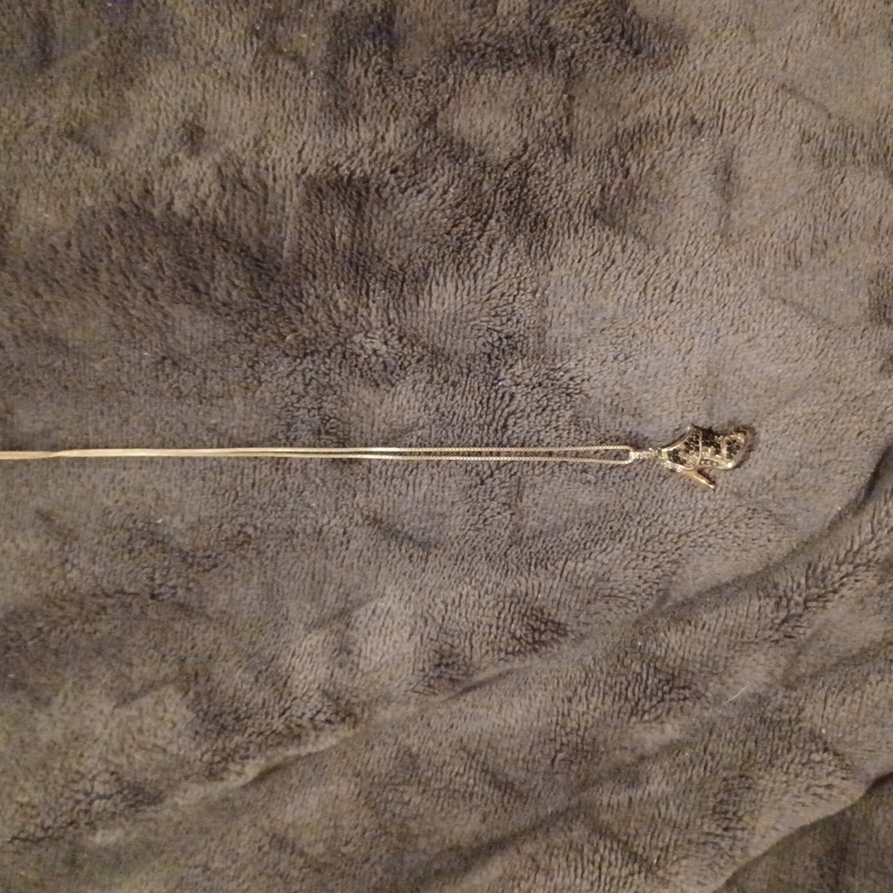 Sterling silver.Black and Champagne diamond bootie pendant. 19 inch chain.